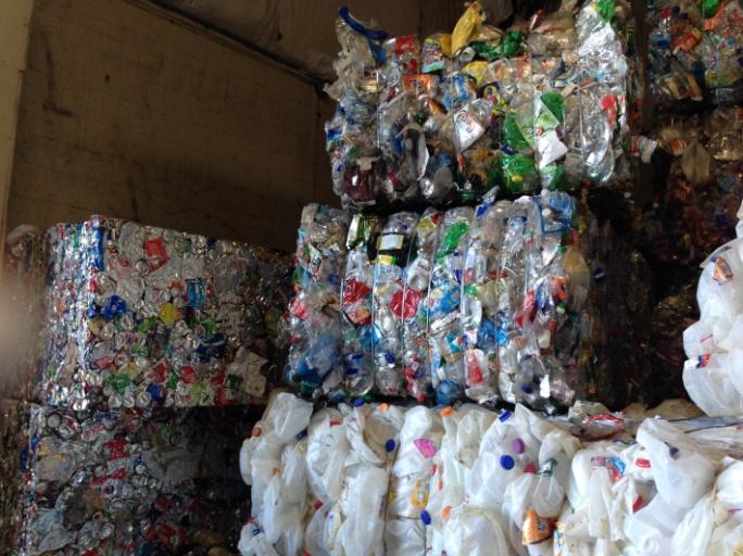 Stacks of plastic containers that are being recycled.
