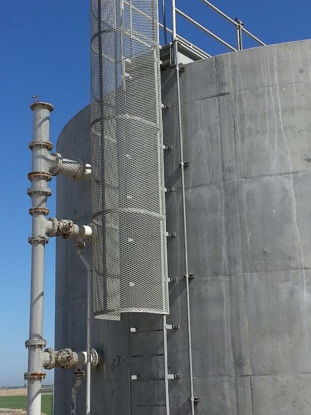 A large grey tank that holds waste water.