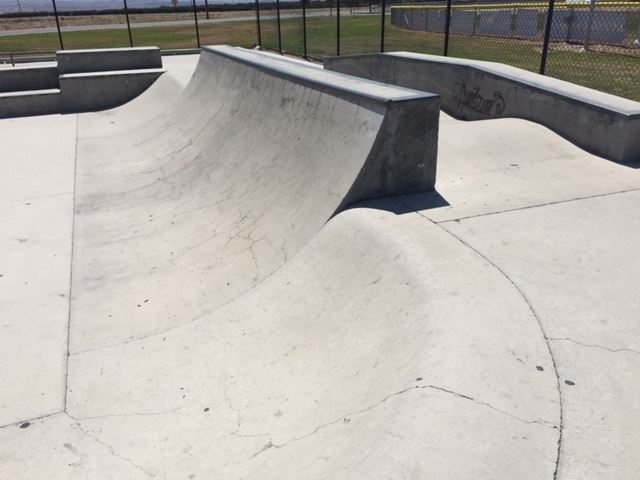 A quarter pipe ramp in a skate park.