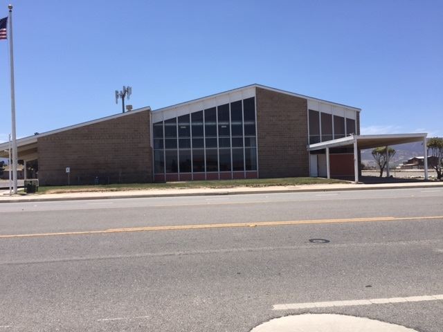 A large brown stone building.